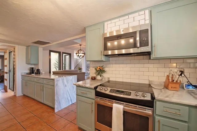 a kitchen with a stove and a microwave