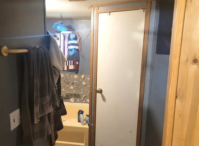 a bed room with a bed and a chandelier