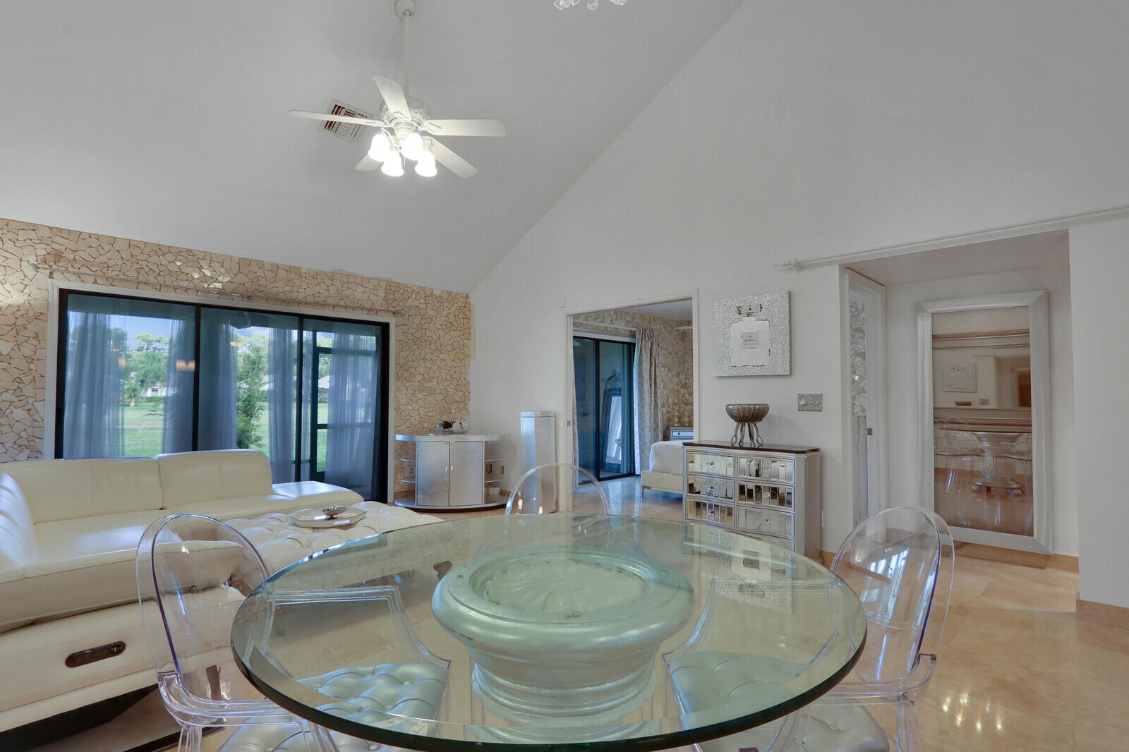 6136 Southeast Georgetown Place Hobe Sound, FL 33455 - Photo 12 of 46 a living room with furniture and a large window