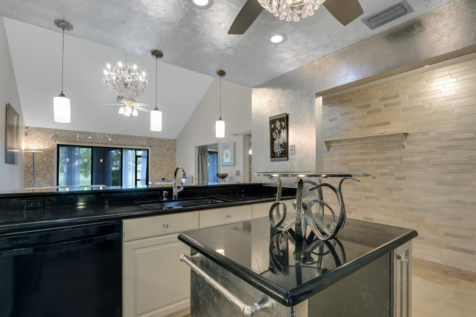 6136 Southeast Georgetown Place Hobe Sound, FL 33455 - Photo 15 of 46 a kitchen with a sink and a refrigerator