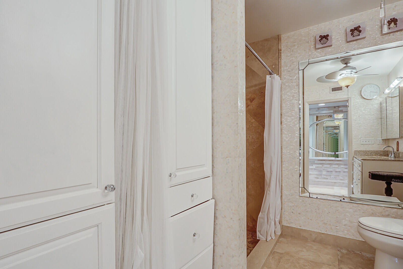 6136 Southeast Georgetown Place Hobe Sound, FL 33455 - Photo 19 of 46 a bathroom with a shower toilet and sink