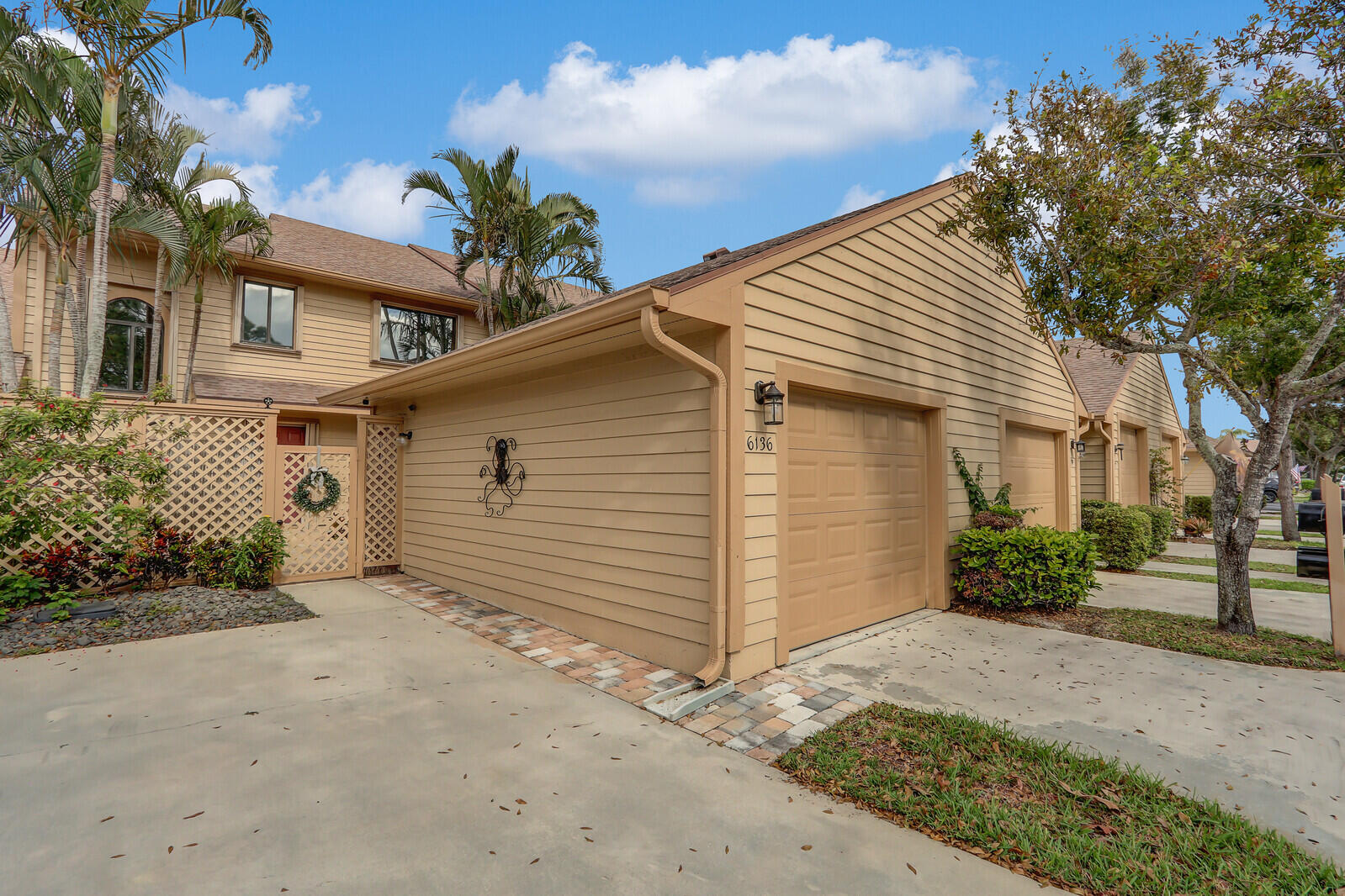 6136 Southeast Georgetown Place Hobe Sound, FL 33455 - Photo 2 of 46 a view of a house with a yard