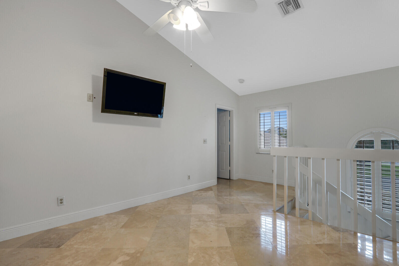 6136 Southeast Georgetown Place Hobe Sound, FL 33455 - Photo 23 of 46 a view of a livingroom with an empty space & a window