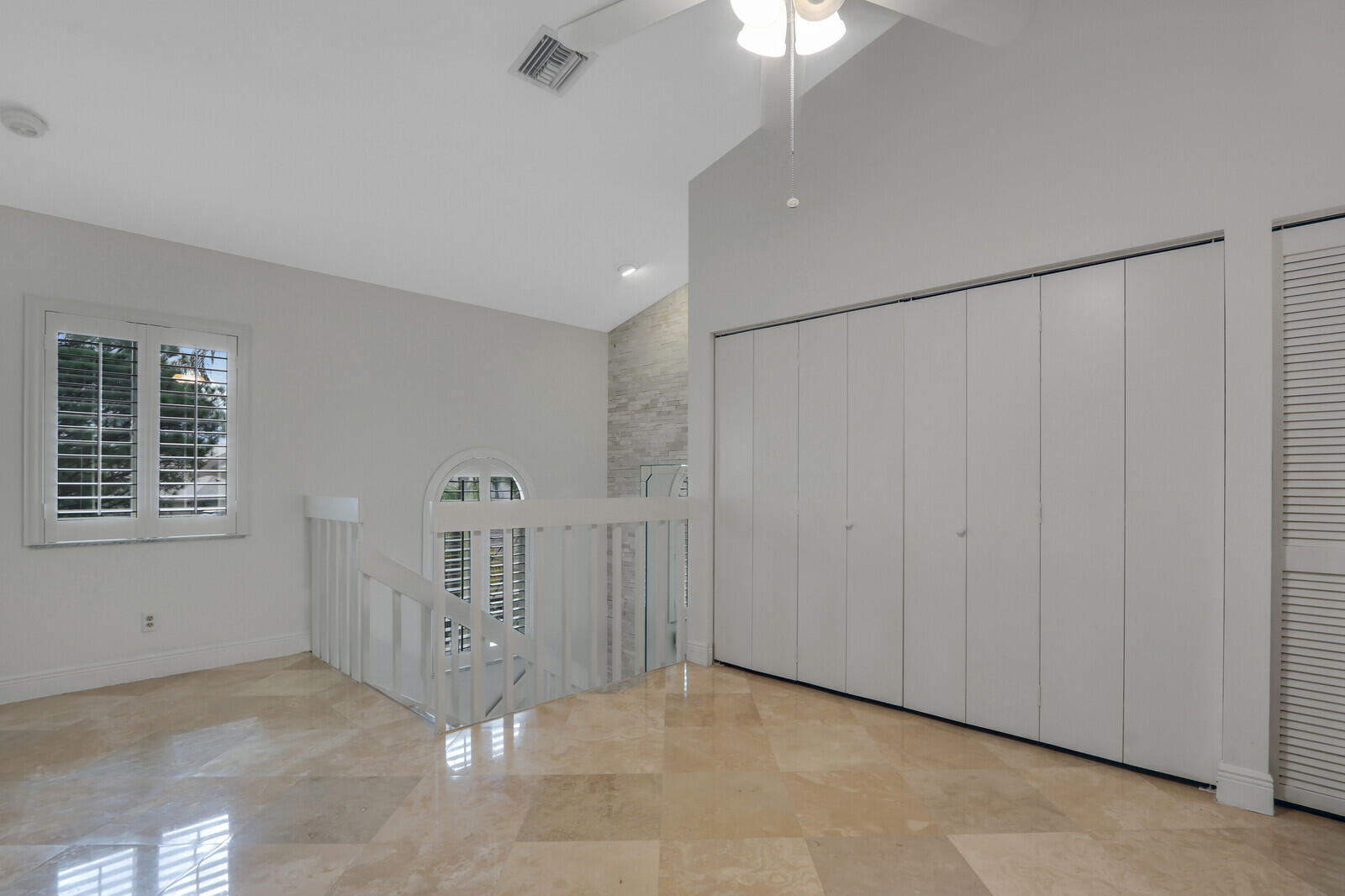 6136 Southeast Georgetown Place Hobe Sound, FL 33455 - Photo 24 of 46 a view of an empty room with a window