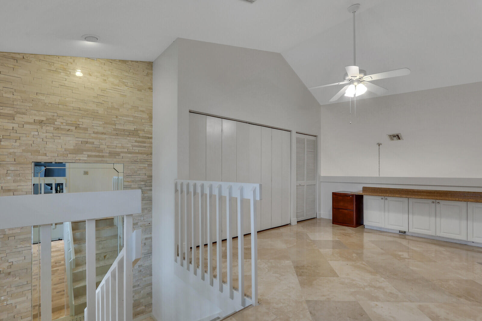 6136 Southeast Georgetown Place Hobe Sound, FL 33455 - Photo 25 of 46 a view of an empty room with a ceiling fan