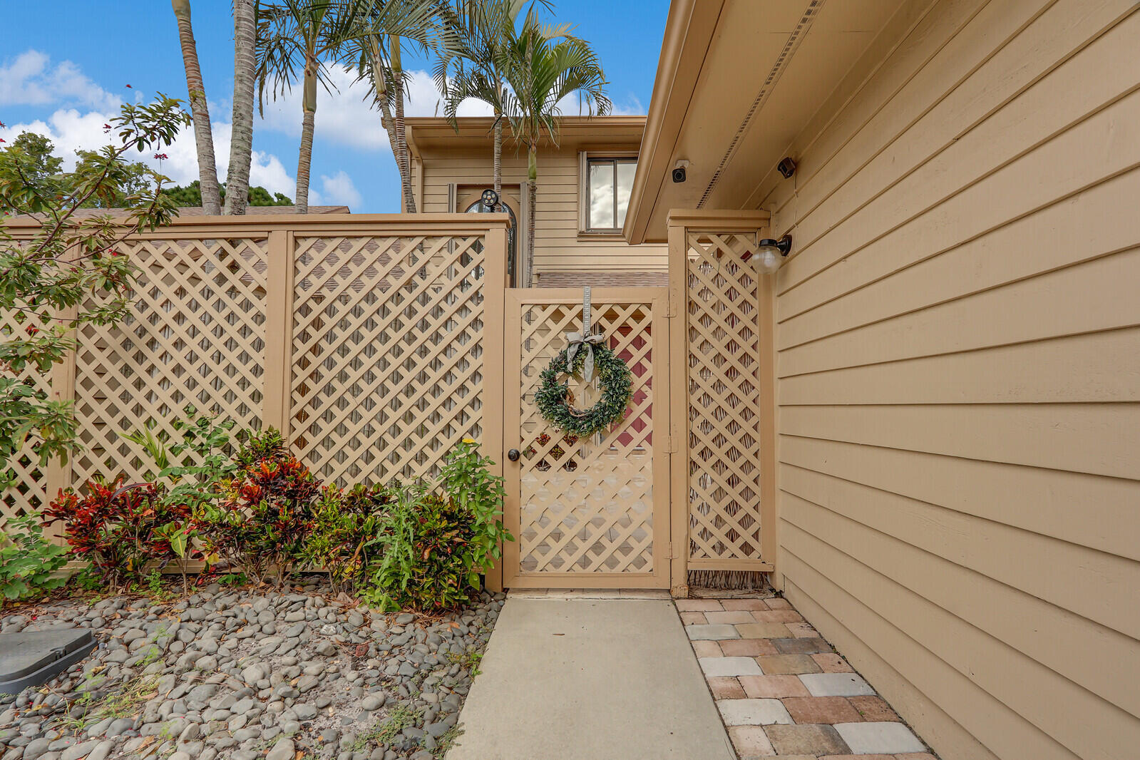 6136 Southeast Georgetown Place Hobe Sound, FL 33455 - Photo 3 of 46 a view of a door and wooden door