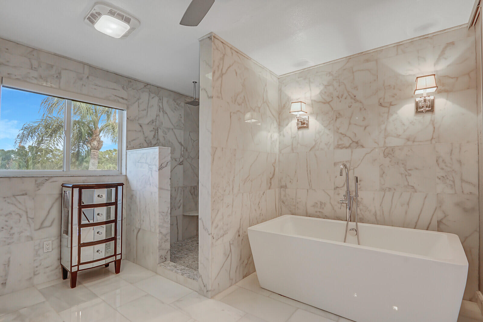 6136 Southeast Georgetown Place Hobe Sound, FL 33455 - Photo 31 of 46 a bathroom with a bathtub and shower