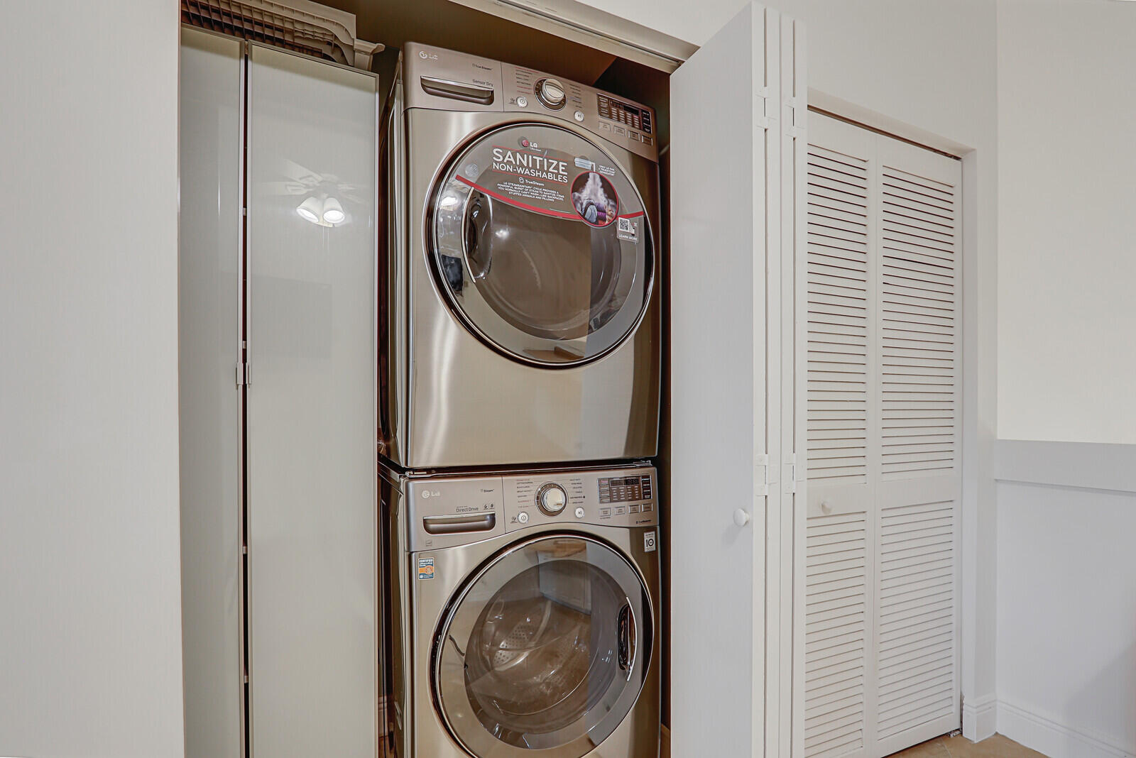 6136 Southeast Georgetown Place Hobe Sound, FL 33455 - Photo 33 of 46 a utility room with dryer and washer