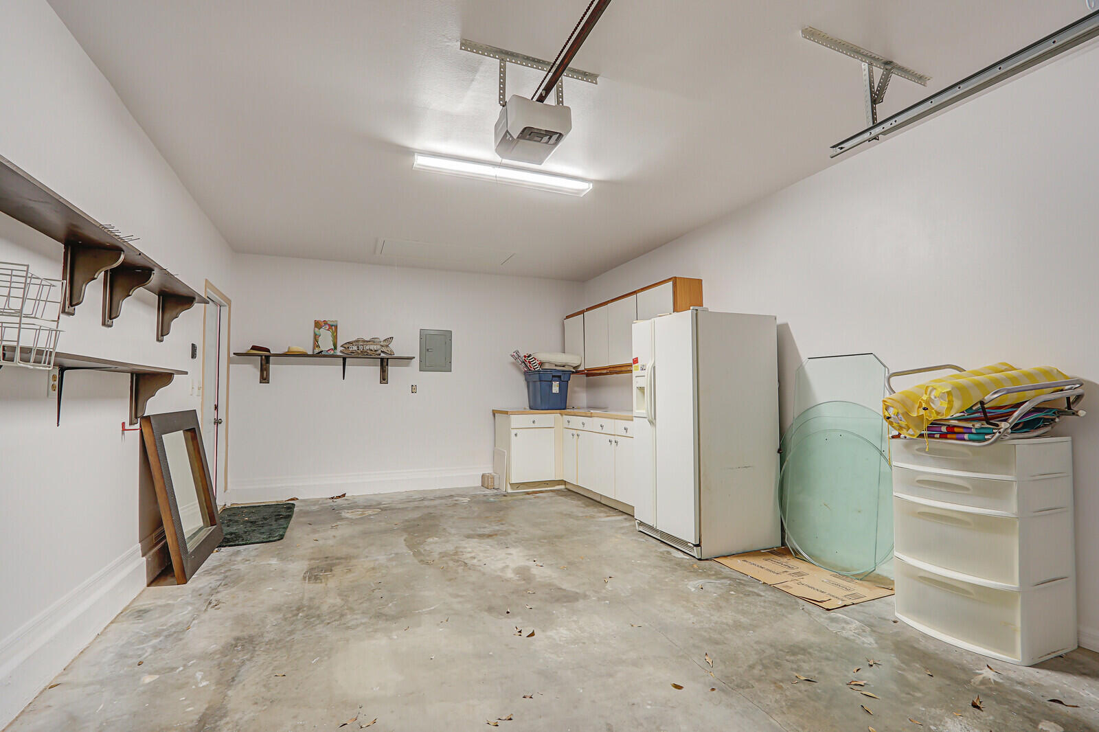 6136 Southeast Georgetown Place Hobe Sound, FL 33455 - Photo 41 of 46 a view of a refrigerator and storage in a room