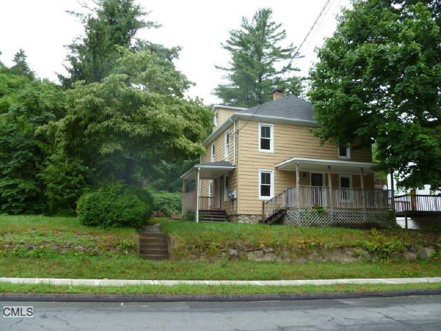 68 Maple Avenue Bethel, CT 06801 - Photo 1 of 1 a front view of a house with a garden