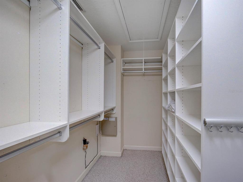 2217 Rising Creek Court Dunedin, FL 34698 - Photo 27 of 45 a view of walk in closet with empty racks