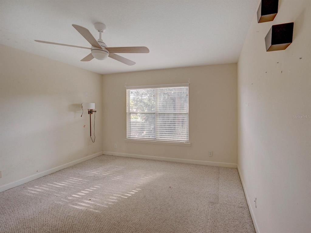 2217 Rising Creek Court Dunedin, FL 34698 - Photo 31 of 45 an empty room with a window