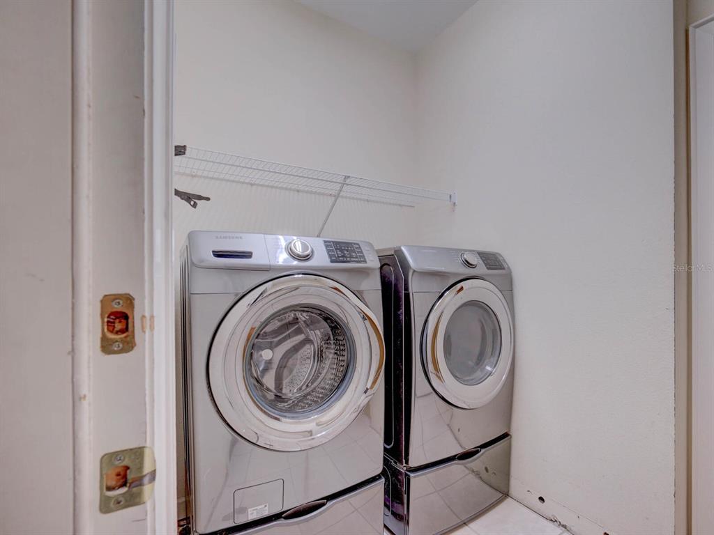 2217 Rising Creek Court Dunedin, FL 34698 - Photo 35 of 45 a utility room with dryer and washer