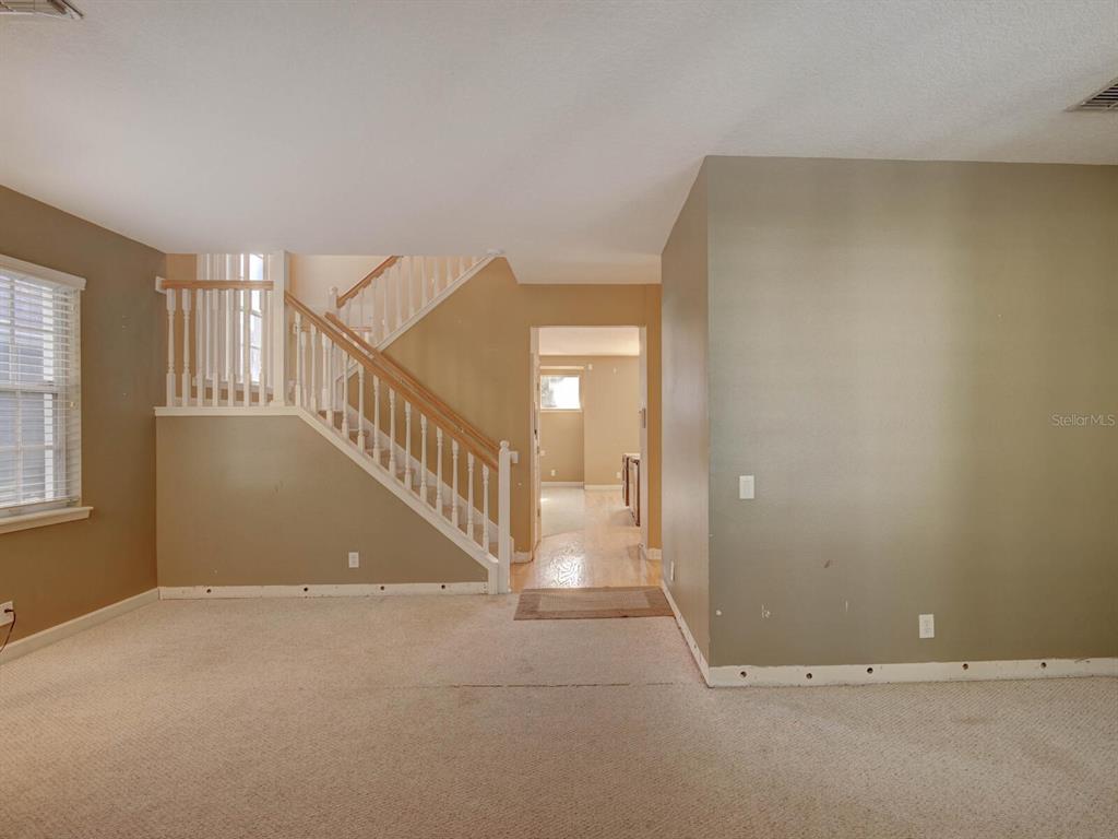 2217 Rising Creek Court Dunedin, FL 34698 - Photo 7 of 45 a view of an entryway with a window