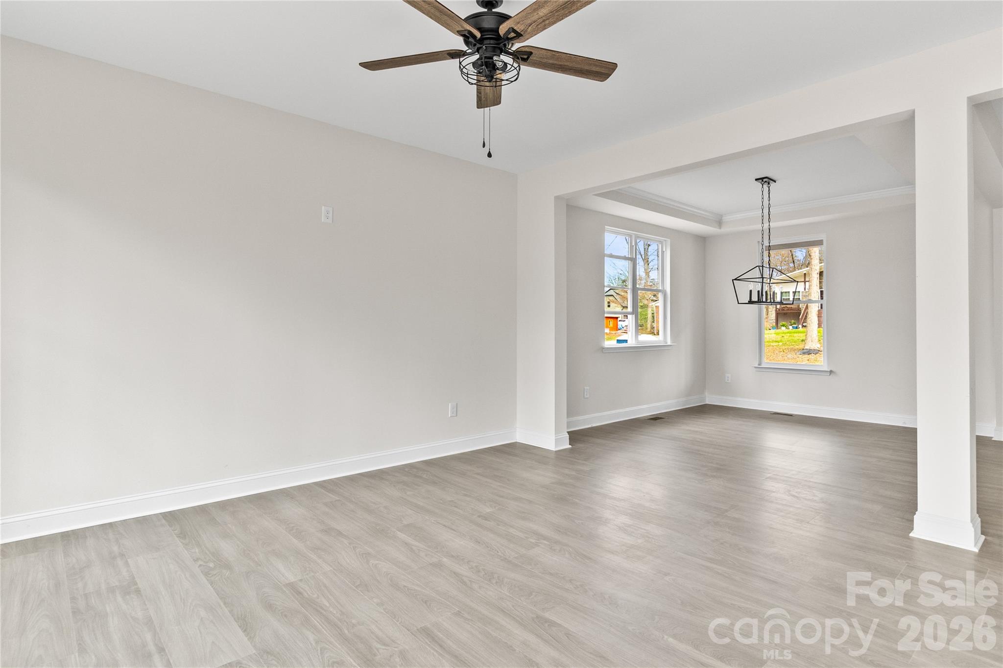 3692 Shannon Loop Denver, NC 28037 - Photo 11 of 47 a view of an empty room with window and wooden floor