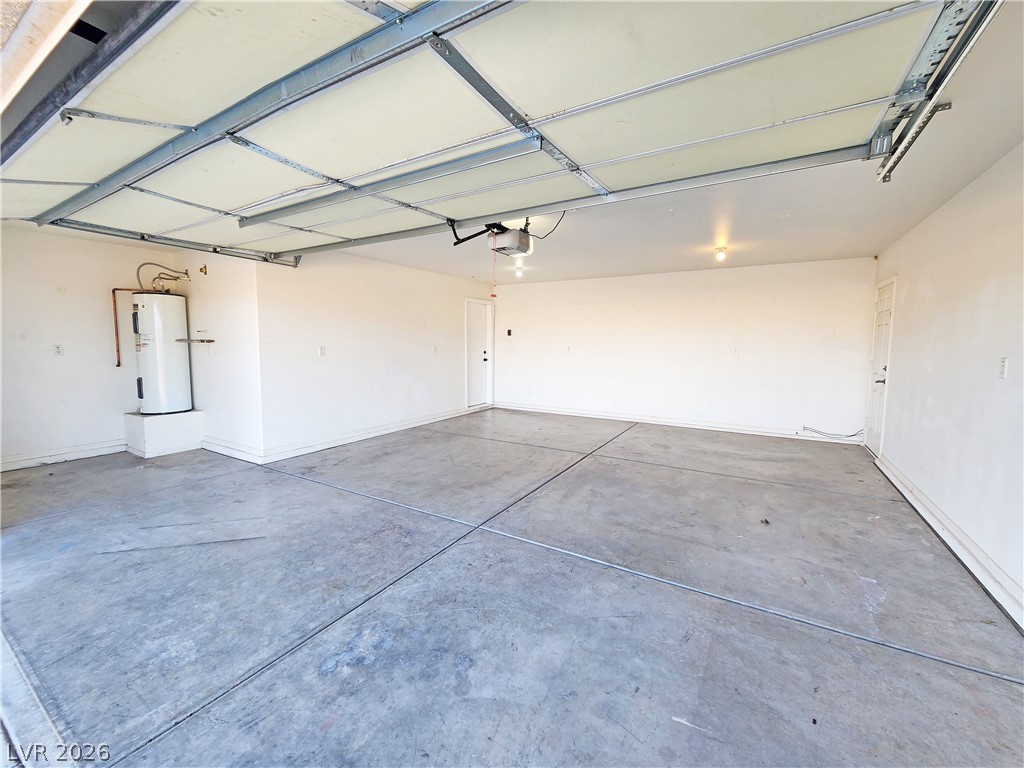 3680 Ravine Avenue Pahrump, NV 89048 - Photo 25 of 28 Garage featuring water heater and a garage door opener
