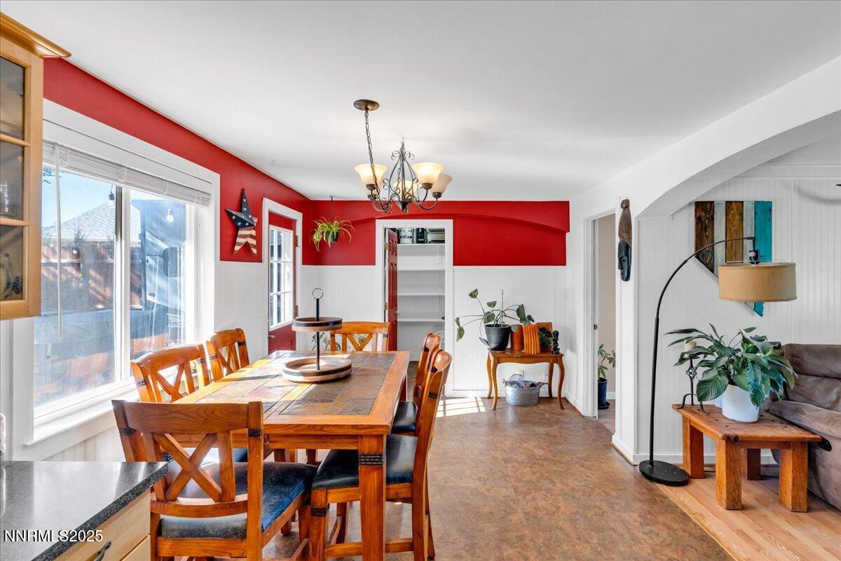 1231 Manhattan Way Gardnerville, NV 89460 - Photo 11 of 45 a dining room with furniture and wooden floor