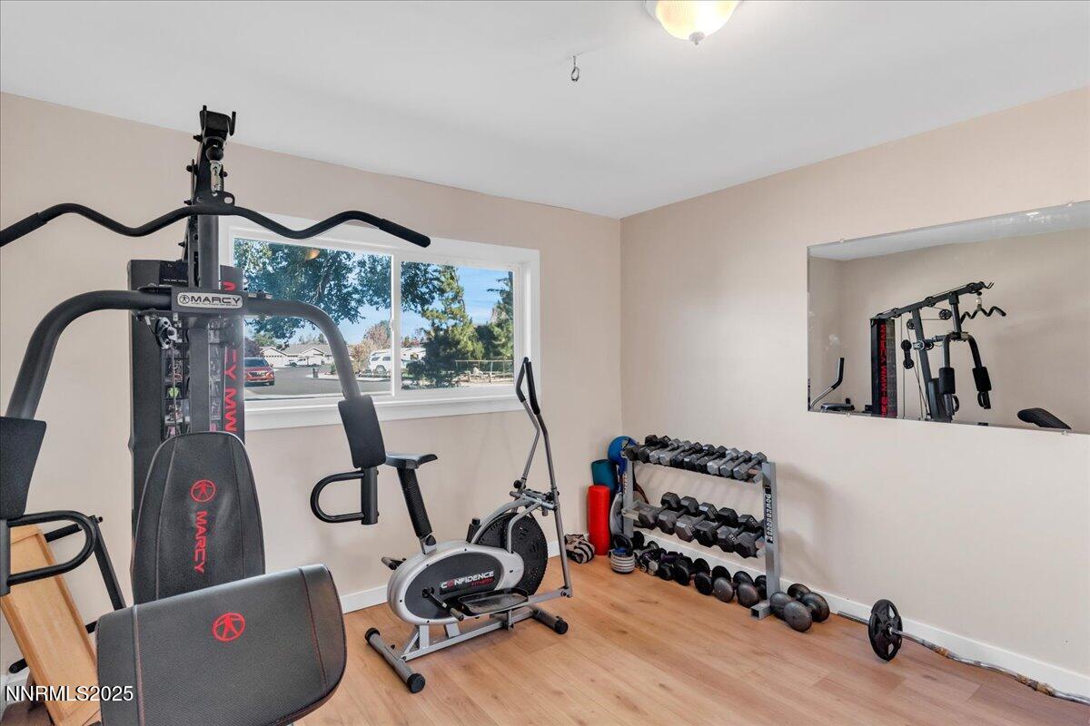1231 Manhattan Way Gardnerville, NV 89460 - Photo 14 of 45 a view of a room with gym equipment