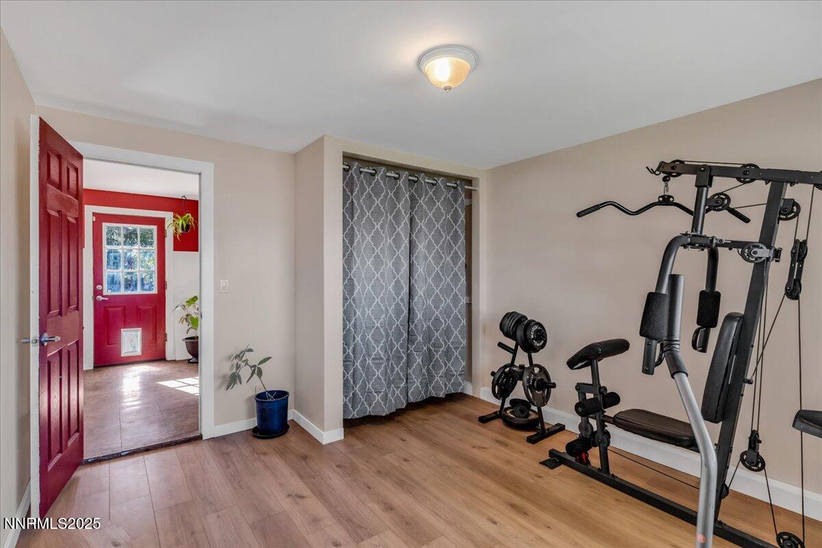 1231 Manhattan Way Gardnerville, NV 89460 - Photo 16 of 45 a view of a room with gym equipment