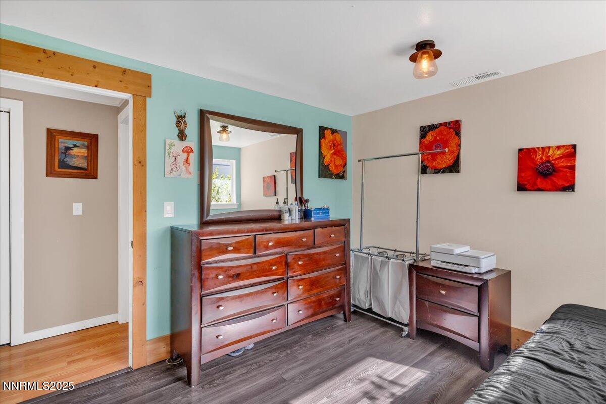 1231 Manhattan Way Gardnerville, NV 89460 - Photo 20 of 45 a view of room with furniture and wooden floor