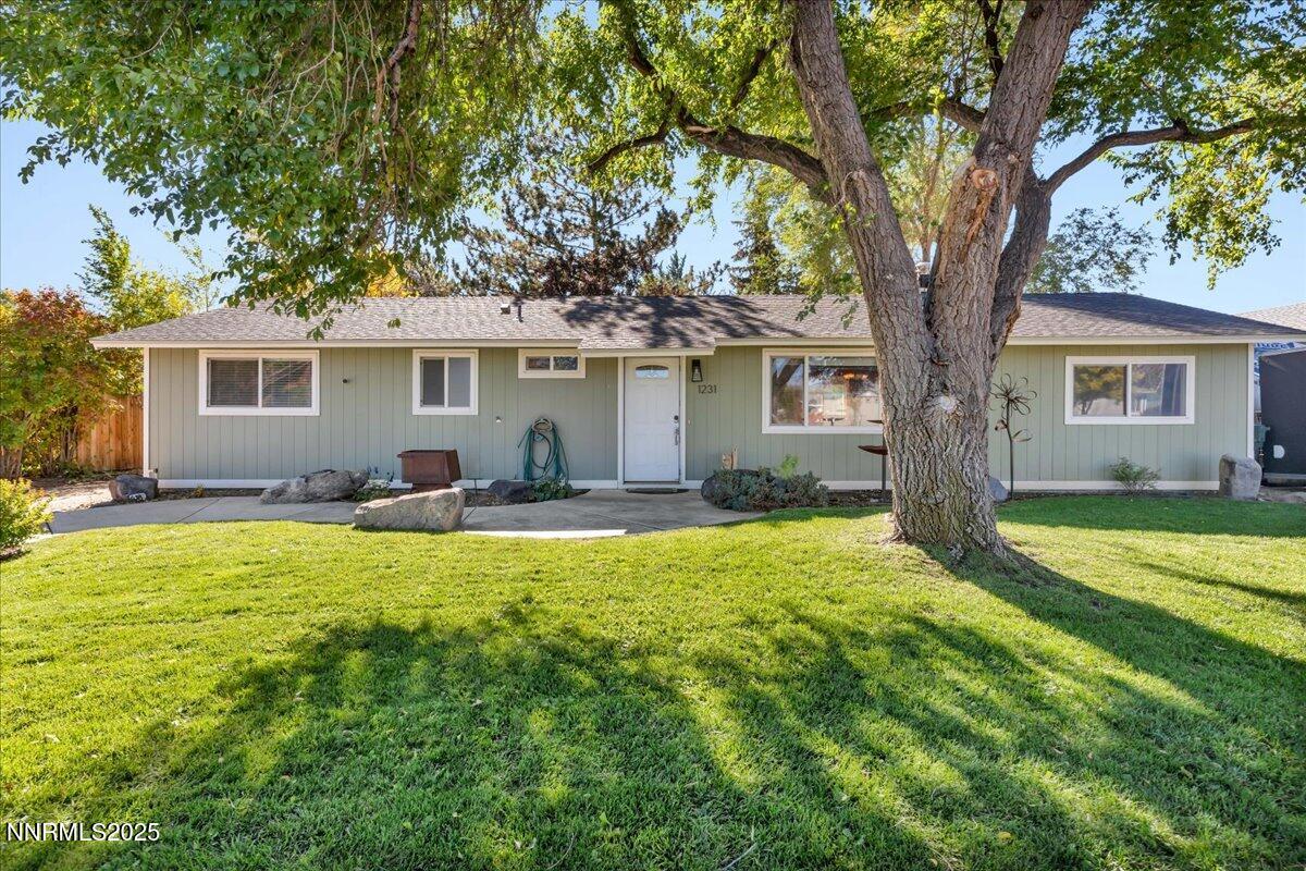 1231 Manhattan Way Gardnerville, NV 89460 - Photo 2 of 45 a house view with swimming pool and garden