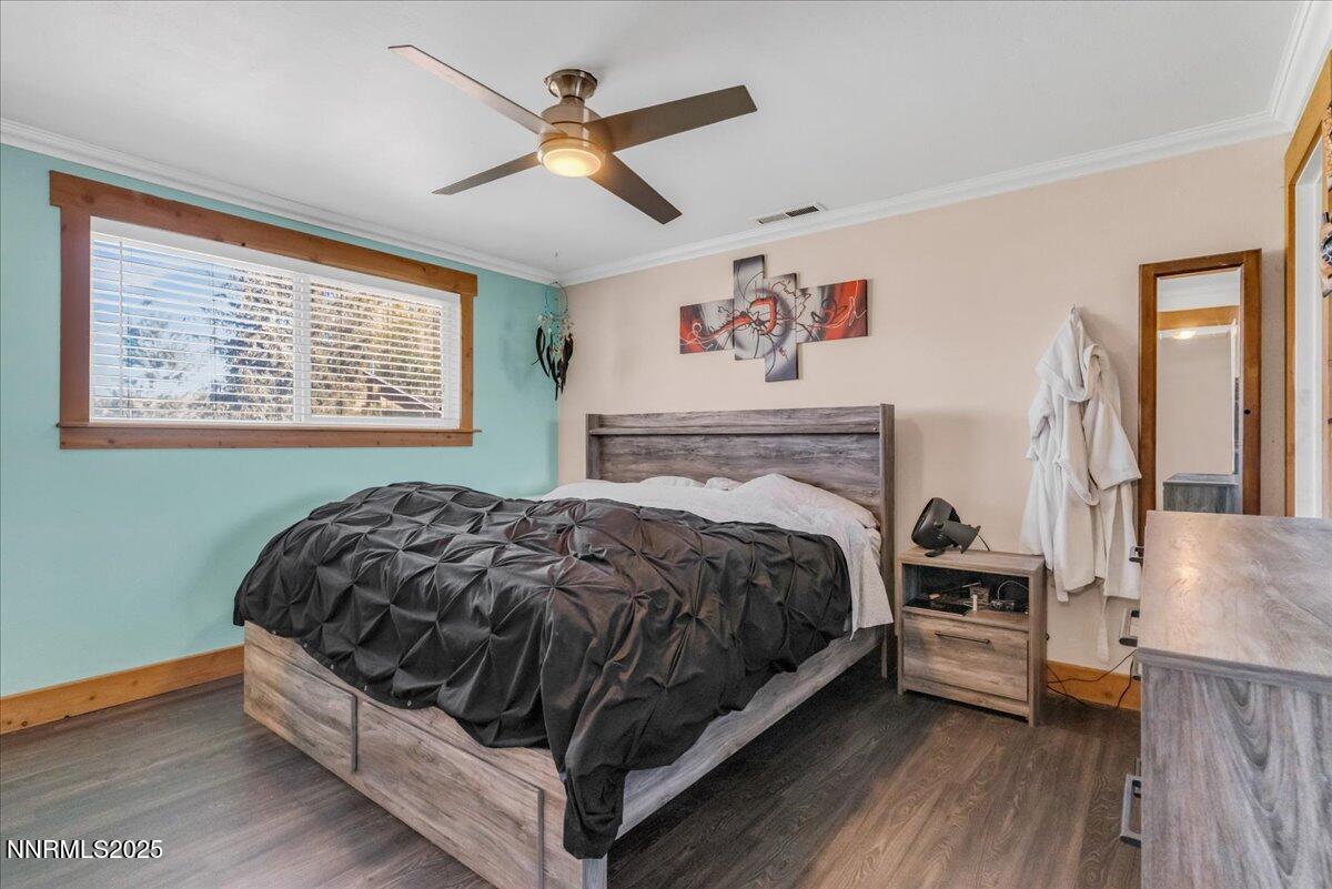 1231 Manhattan Way Gardnerville, NV 89460 - Photo 21 of 45 a bedroom with a bed and a large window