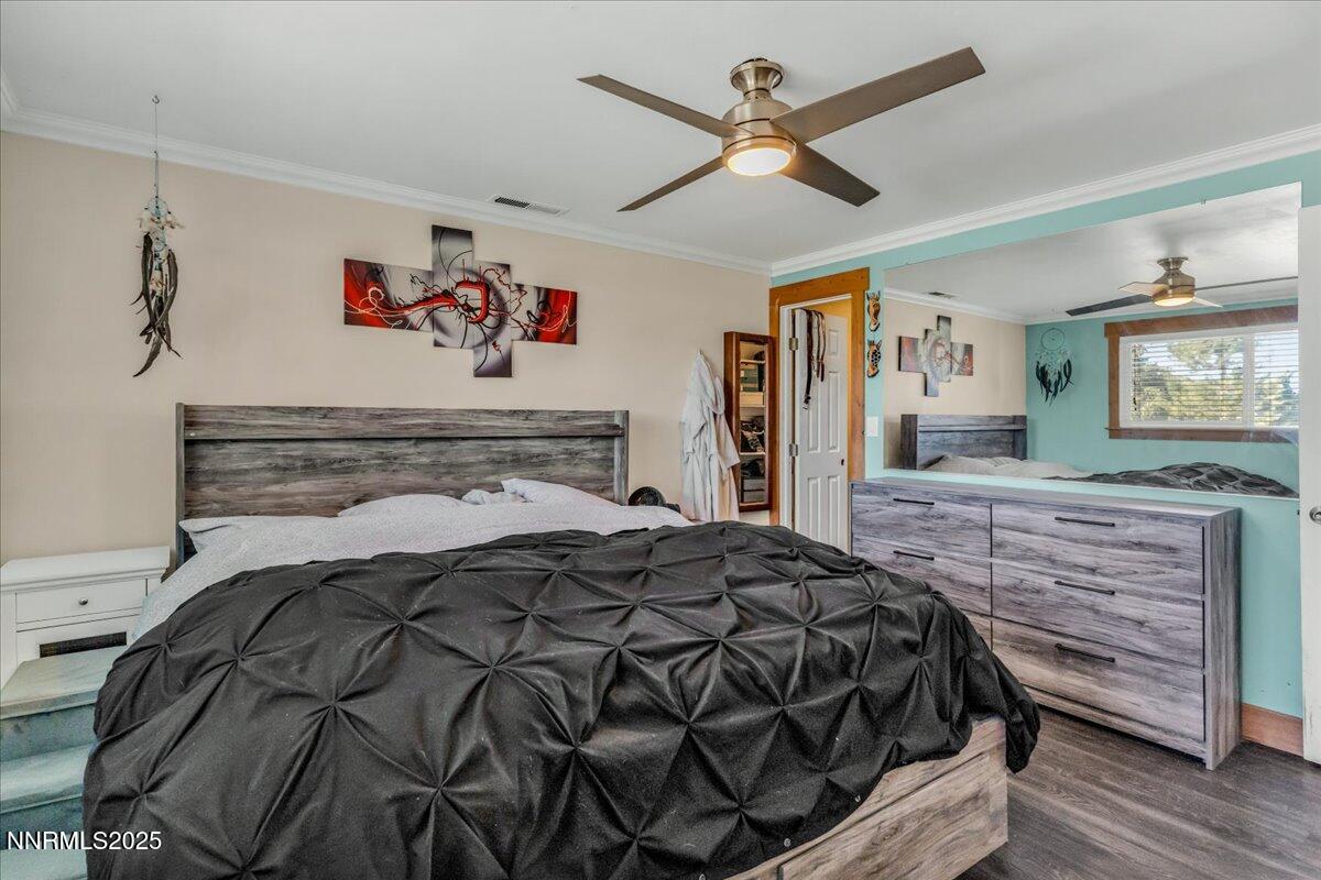 1231 Manhattan Way Gardnerville, NV 89460 - Photo 22 of 45 a bedroom with a bed and a dresser