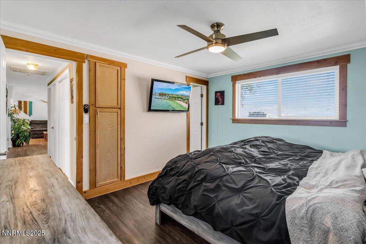 1231 Manhattan Way Gardnerville, NV 89460 - Photo 24 of 45 a bedroom with a bed and a window