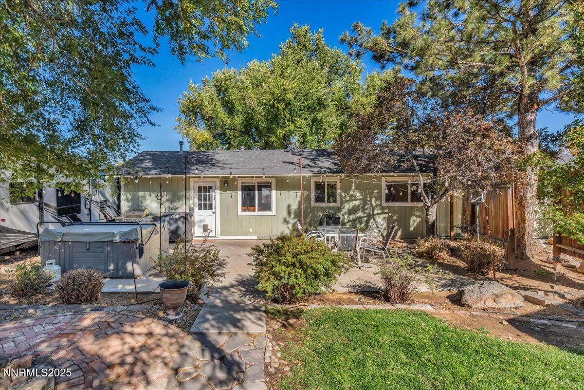 1231 Manhattan Way Gardnerville, NV 89460 - Photo 29 of 45 a front view of a house with garden