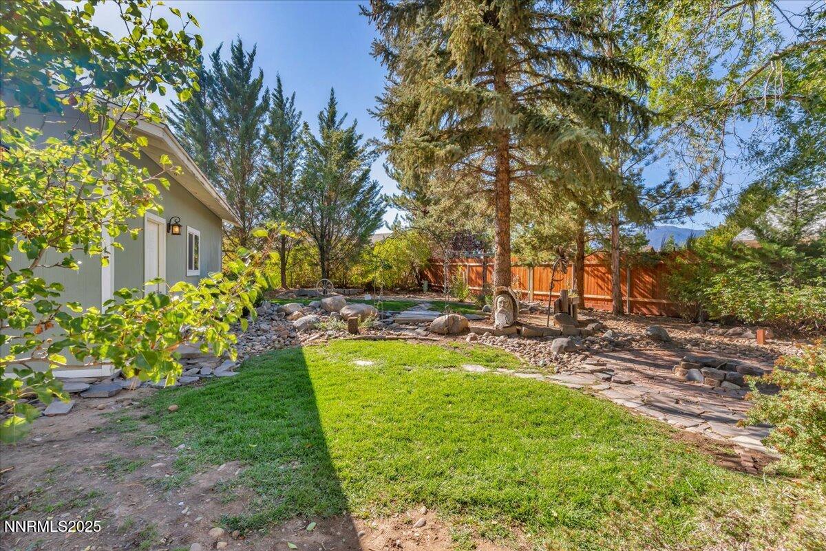 1231 Manhattan Way Gardnerville, NV 89460 - Photo 36 of 45 a view of backyard with swimming pool