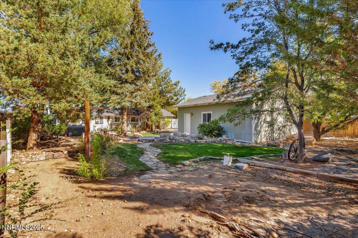 1231 Manhattan Way Gardnerville, NV 89460 - Photo 37 of 45 a view of a house with a yard