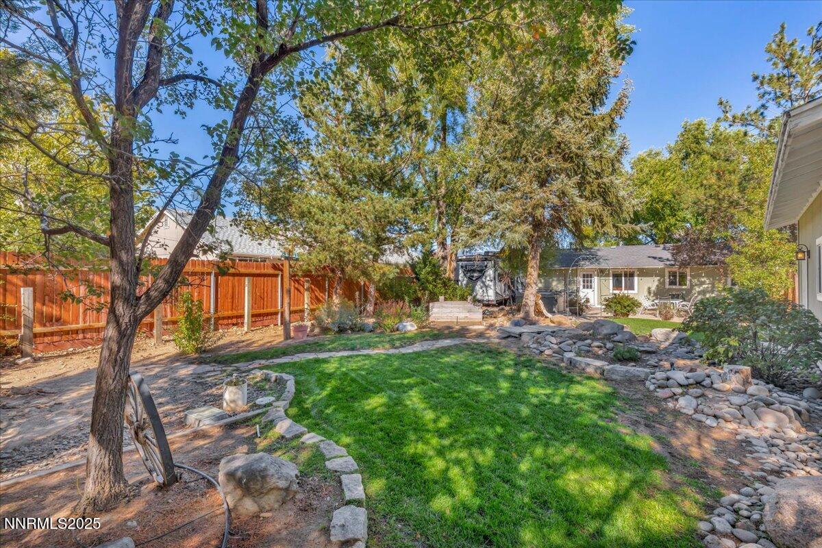 1231 Manhattan Way Gardnerville, NV 89460 - Photo 39 of 45 a backyard of a house with table and chairs