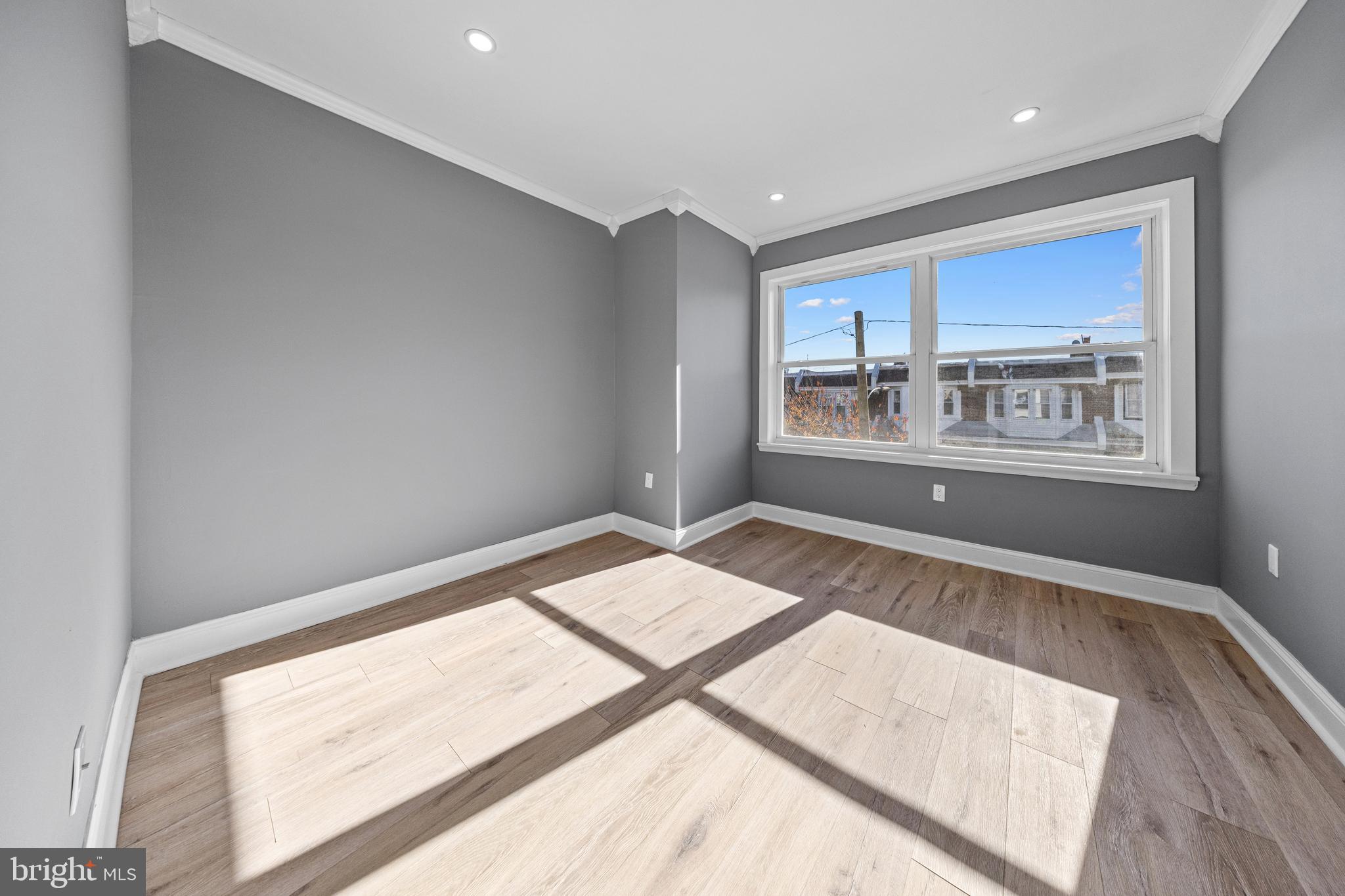 5325 Kershaw Street Philadelphia, PA 19131 - Photo 11 of 20 a view of empty room with wooden floor and fan