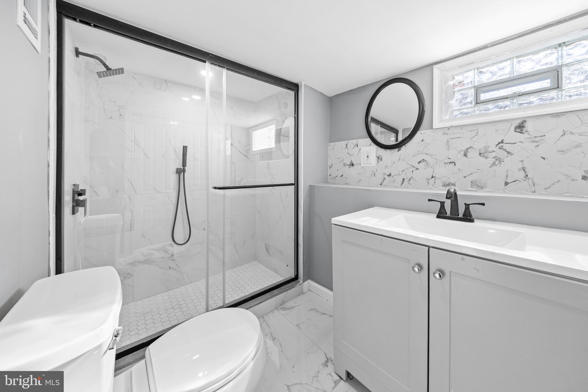 5325 Kershaw Street Philadelphia, PA 19131 - Photo 15 of 20 a bathroom with a sink toilet and shower