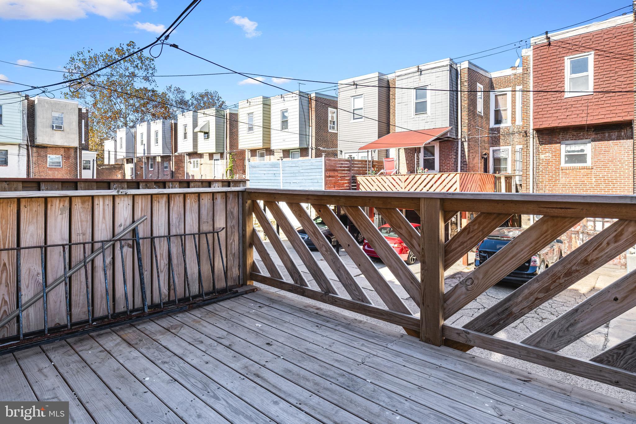 5325 Kershaw Street Philadelphia, PA 19131 - Photo 19 of 20 a view of a balcony with wooden floor and fence