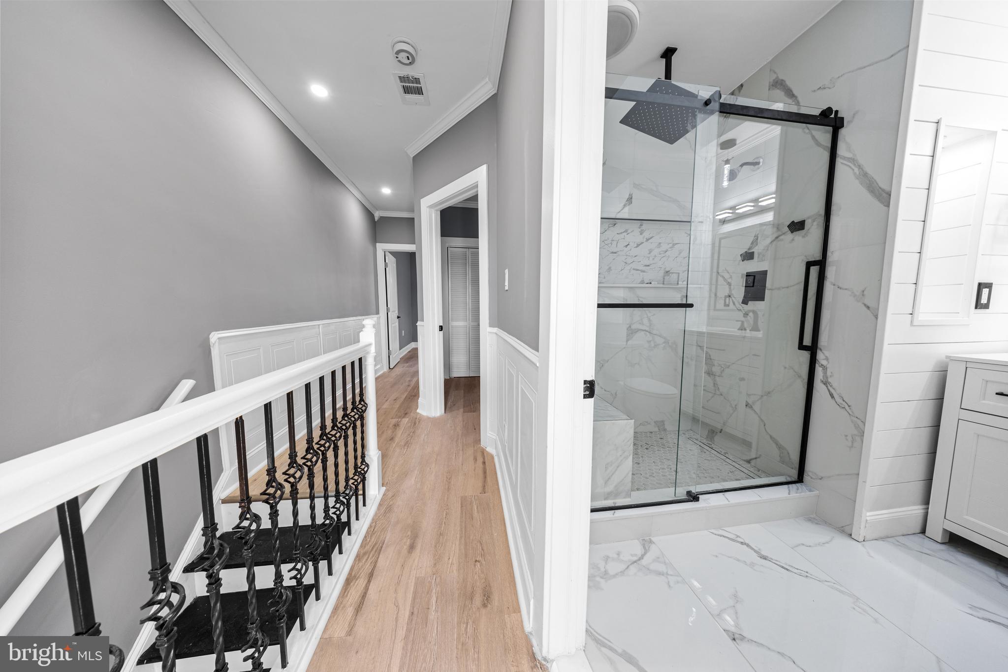 5325 Kershaw Street Philadelphia, PA 19131 - Photo 7 of 20 a view of a hallway with wooden floor and staircase