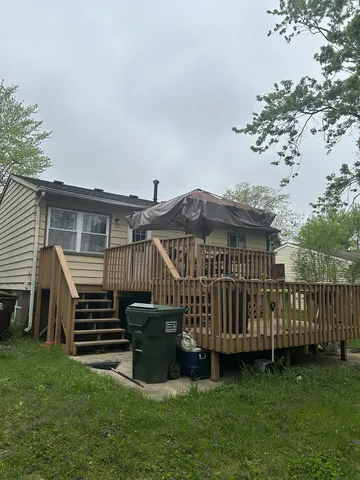 a view of a deck with a yard