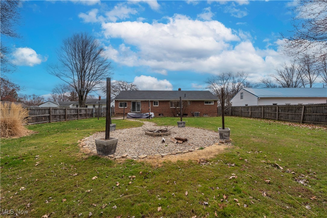 11518 Prospect Road Strongsville, OH 44149 - Photo 40 of 46 View of yard featuring a fire pit and a fenced backyard