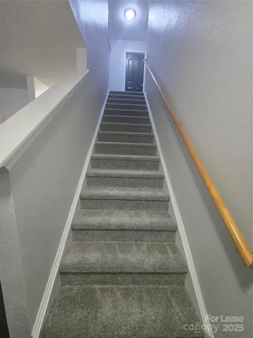 a view of wooden floor and windows in a room