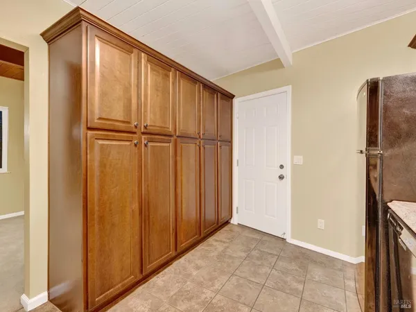 a view of a livingroom with a ceiling fan and window