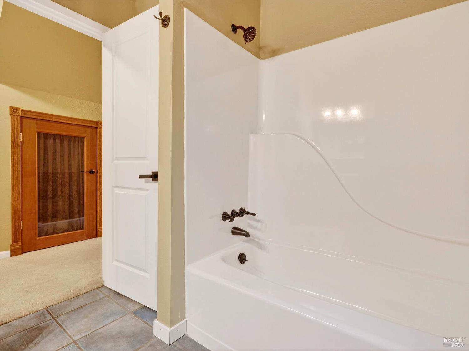 1290 Adobe Canyon Road Kenwood, CA 95452 - Photo 20 of 62 a bathroom with a bathtub