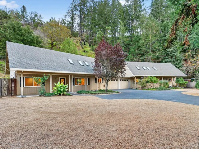 front view of a house next to a yard