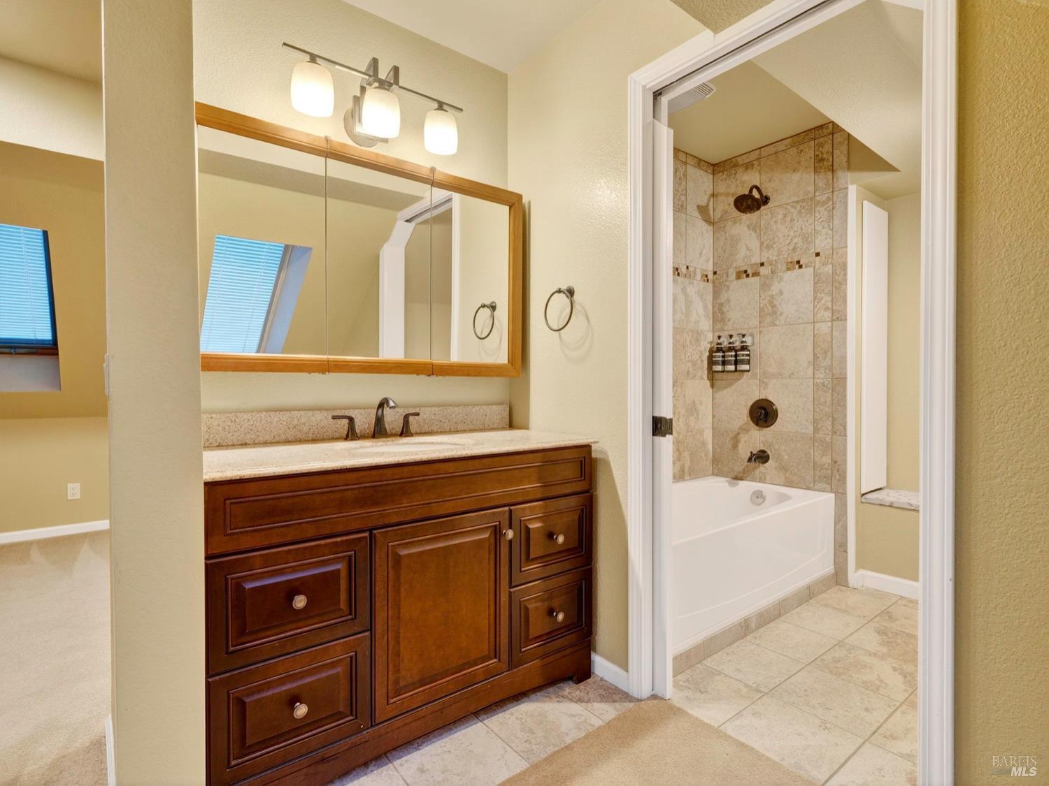 1290 Adobe Canyon Road Kenwood, CA 95452 - Photo 25 of 62 a spacious bathroom with a tub sink and mirror