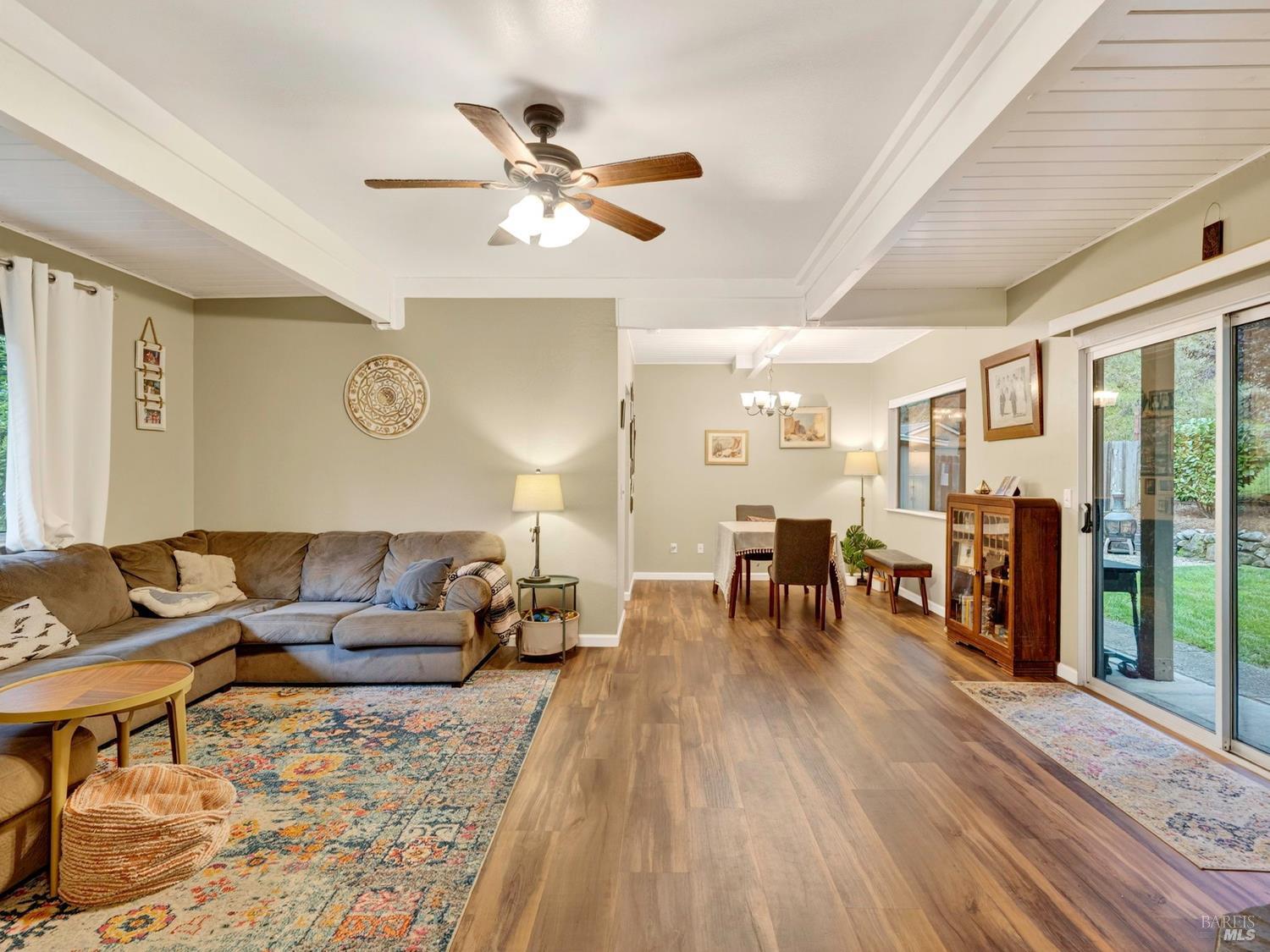 1290 Adobe Canyon Road Kenwood, CA 95452 - Photo 31 of 62 a living room with furniture and wooden floor