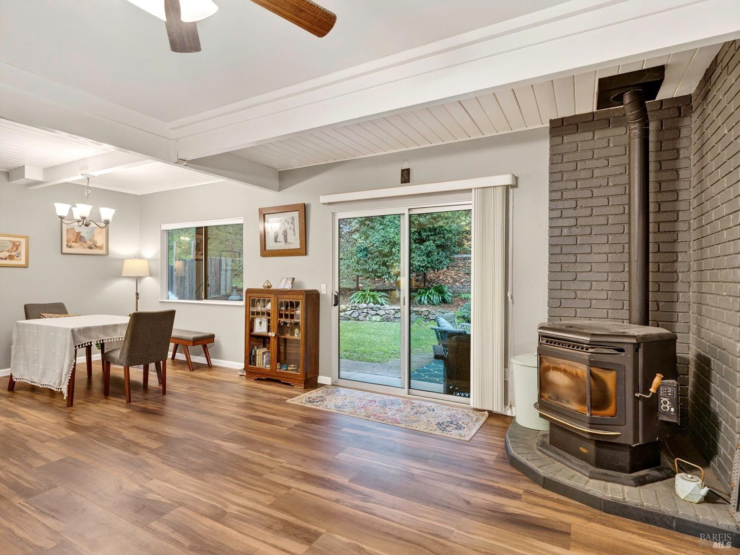1290 Adobe Canyon Road Kenwood, CA 95452 - Photo 32 of 62 a living room with furniture and a fireplace