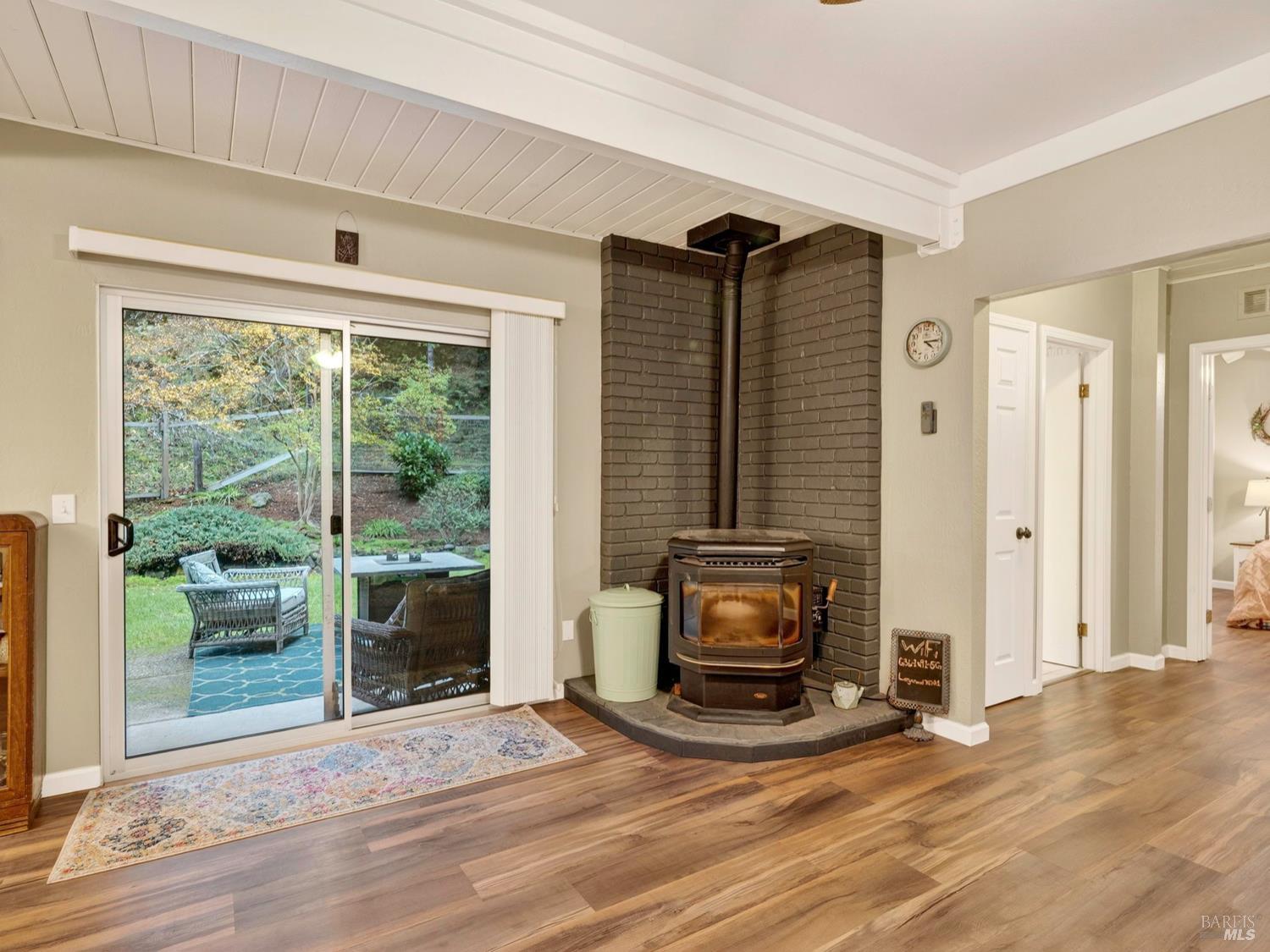 1290 Adobe Canyon Road Kenwood, CA 95452 - Photo 34 of 62 a view of a livingroom with furniture and a fireplace