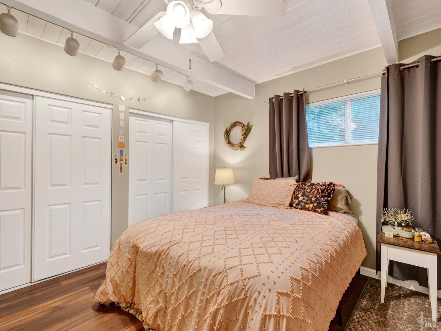 1290 Adobe Canyon Road Kenwood, CA 95452 - Photo 38 of 62 a bedroom with a bed and a table