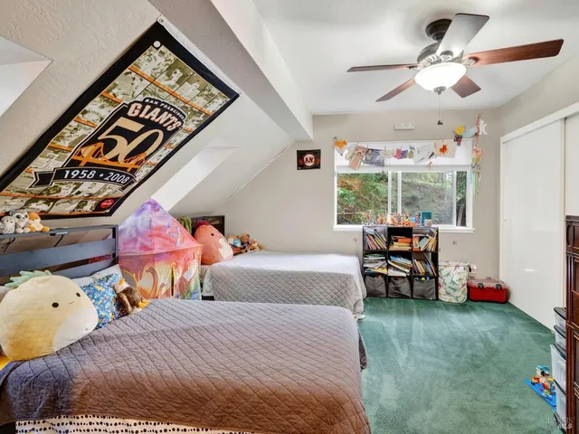 a front view of a house with plants