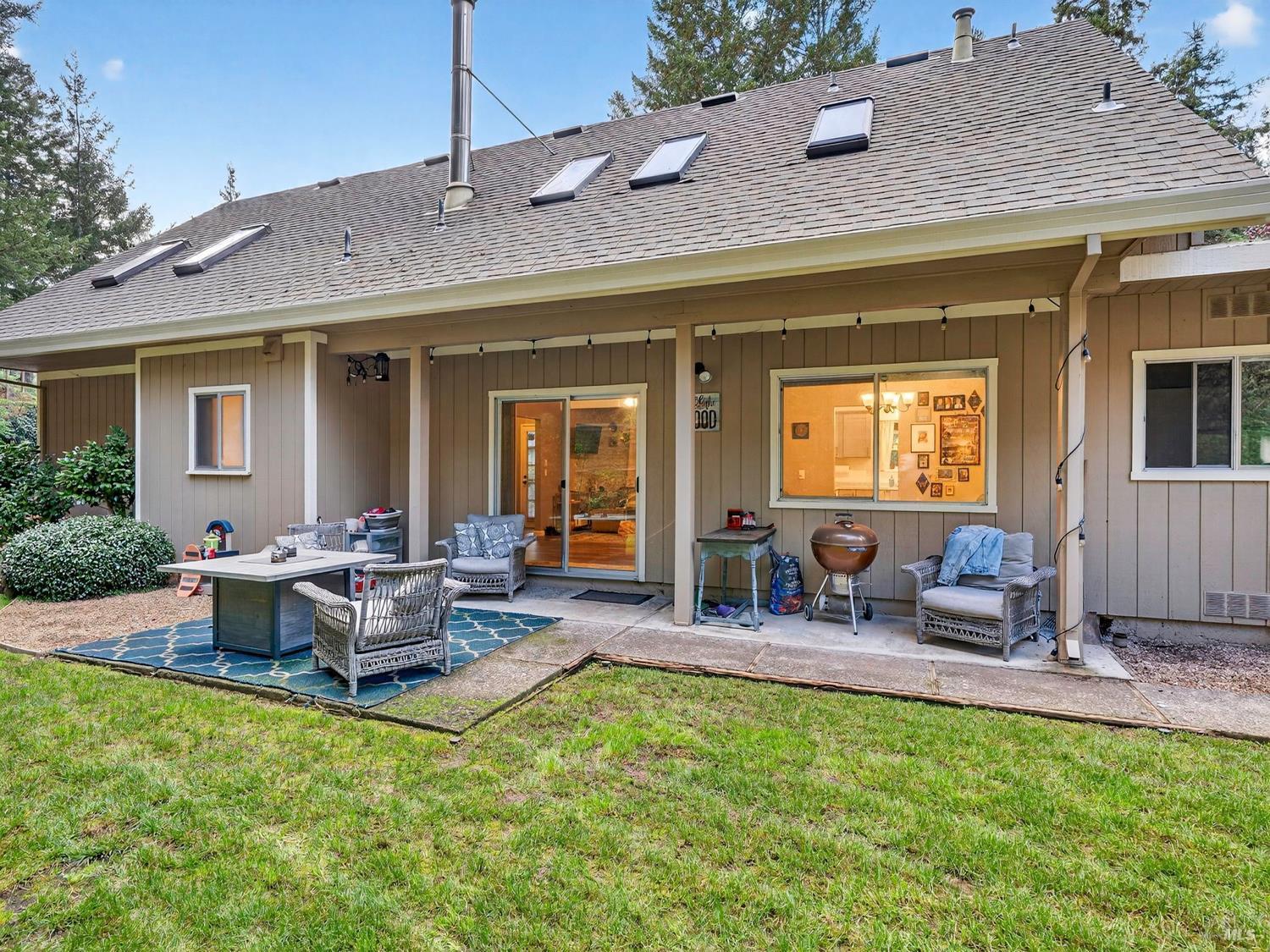 1290 Adobe Canyon Road Kenwood, CA 95452 - Photo 46 of 62 a view of the house with backyard and outdoor seating