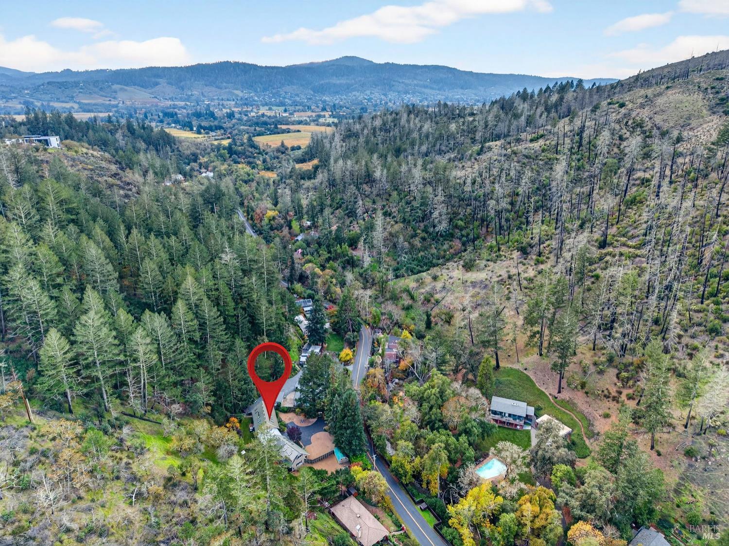 1290 Adobe Canyon Road Kenwood, CA 95452 - Photo 54 of 62 an aerial view of a house with a yard and mountain